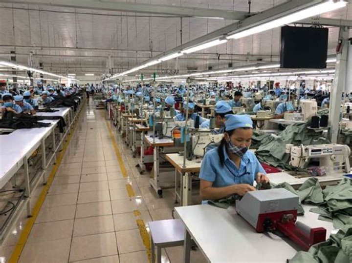 How do companies benefit from sweatshops?