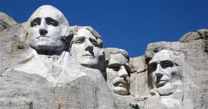 Why do people build monuments and memorials?